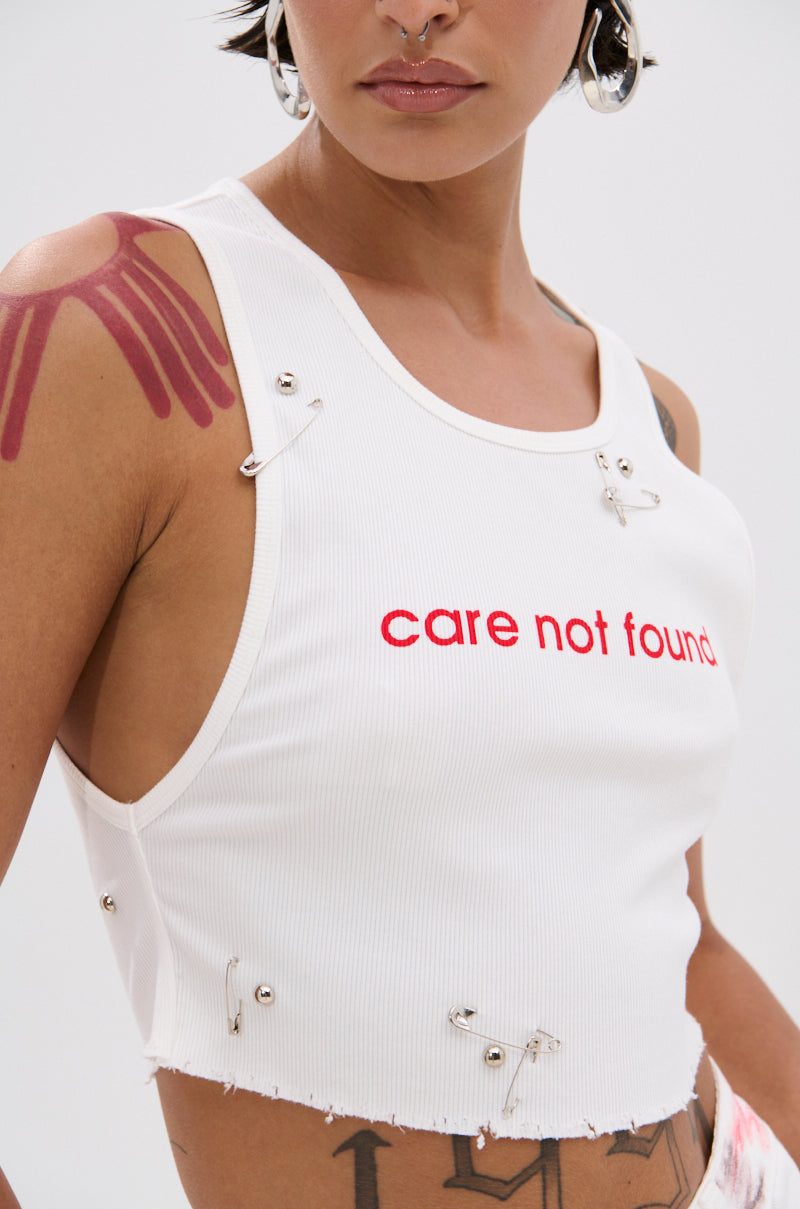 NEVER CARED DISTRESSED CROPPED TANK TOP